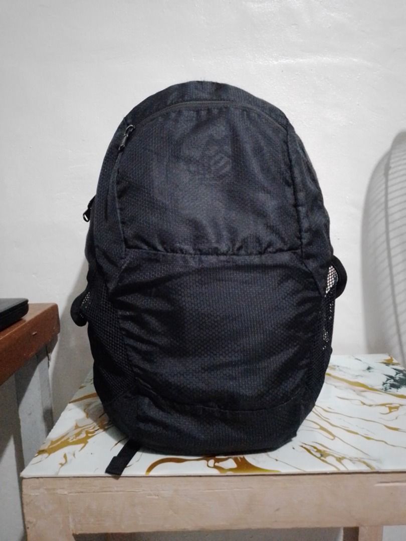ultralight packable small backpack (Category: Backpacks) located in Imus. Submitted by bestfinds_yeth0724 (Listing ID 1466737484, Image 1). Description: - Color: Sleek black with a unique honeycomb exterior texture - Durability: Equipped with heavy-duty YKK zippers on main and side compartments - Storage: Convenient mesh side pockets for water bottles and small essentials - Comfort: Features padded shoulder straps and a sturdy top grab handle - C
