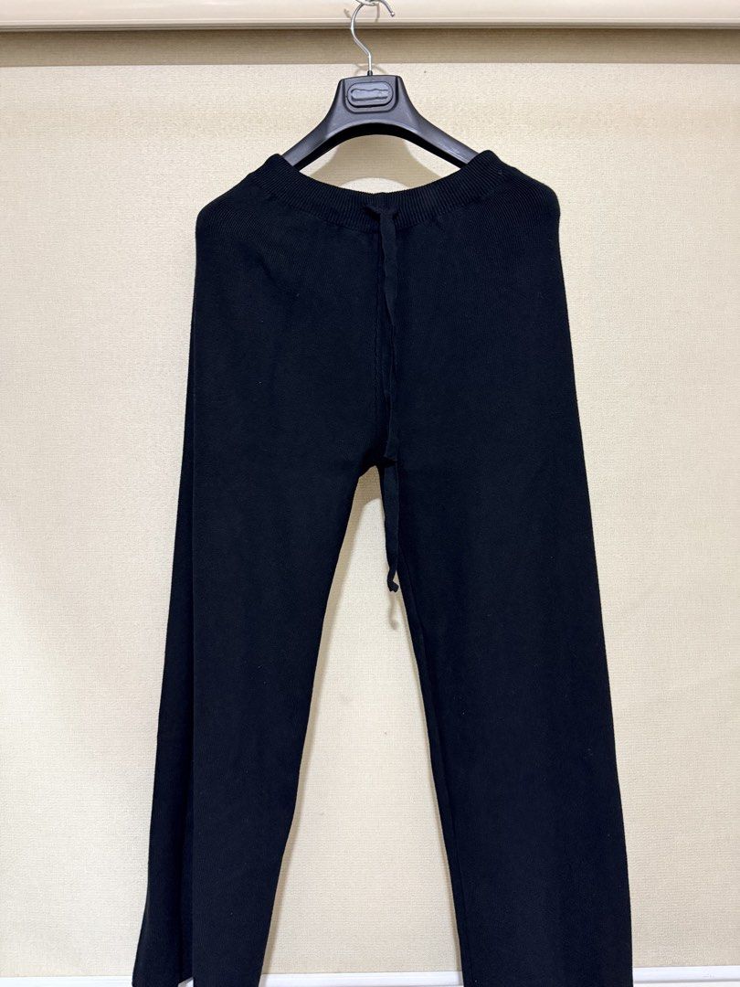 Black Knitted Drawstring Pants (Category: Other Bottoms) located in Cavite. Submitted by mgd.blessed (Listing ID 1466696601, Image 3). Description: - Color: Black - Material: Soft ribbed knit texture - Fit: Relaxed straight leg - Waist: Comfortable elastic waistband with adjustable drawstring (approx. 13" across flat) - Condition: Clean inside and out, ready to wear - Styling: Easy to match with casual tees or cozy sweaters.