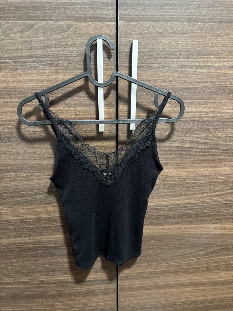 Black Lace Trim Cami Tank Top (Category: Sleeveless) located in Manila. Submitted by katrinakatee (Listing ID 1466674615, Image 1). Description: - Color: Black - Style: Slim fit ribbed tank top with delicate lace trim along the V-neckline - Material: Soft and stretchy fabric for all-day comfort - Versatility: Great basic piece for layering or wearing on its own in warm weather - Condition: Brand new / Excellent quality - Mode of Payment: GCash, B