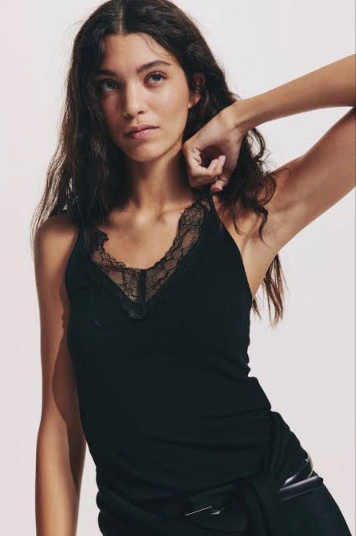 Black Lace Trim Cami Tank Top (Category: Sleeveless) located in Manila. Submitted by katrinakatee (Listing ID 1466674615, Image 2). Description: - Color: Black - Style: Slim fit ribbed tank top with delicate lace trim along the V-neckline - Material: Soft and stretchy fabric for all-day comfort - Versatility: Great basic piece for layering or wearing on its own in warm weather - Condition: Brand new / Excellent quality - Mode of Payment: GCash, B