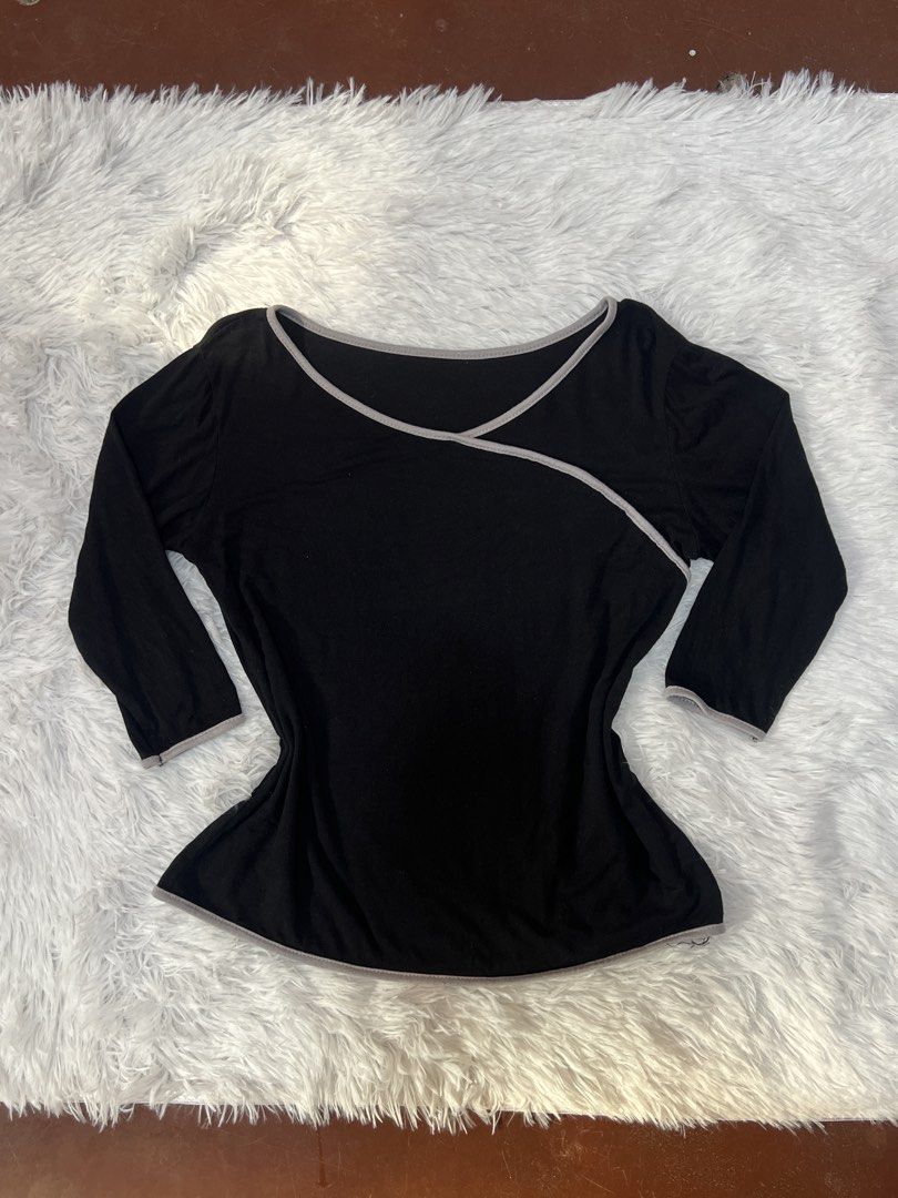 Black Long Sleeve Top with Grey Trim Wrap Design (Category: Longsleeves) located in Tuguegarao City. Submitted by love_clothies (Listing ID 1466572883, Image 1). Description: - Color & Style: Black top with stylish grey piping trim and a wrap-style diagonal front - Size: Small to Medium - Neckline: Open scoop neckline - Sleeves: Three-quarter length sleeves - Fit & Fabric: Fitted cut through the waist made from soft, lightweight, and stretchable 