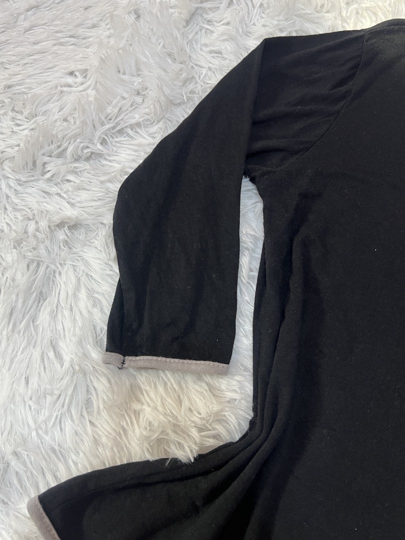 Black Long Sleeve Top with Grey Trim Wrap Design (Category: Longsleeves) located in Tuguegarao City. Submitted by love_clothies (Listing ID 1466572883, Image 2). Description: - Color & Style: Black top with stylish grey piping trim and a wrap-style diagonal front - Size: Small to Medium - Neckline: Open scoop neckline - Sleeves: Three-quarter length sleeves - Fit & Fabric: Fitted cut through the waist made from soft, lightweight, and stretchable 