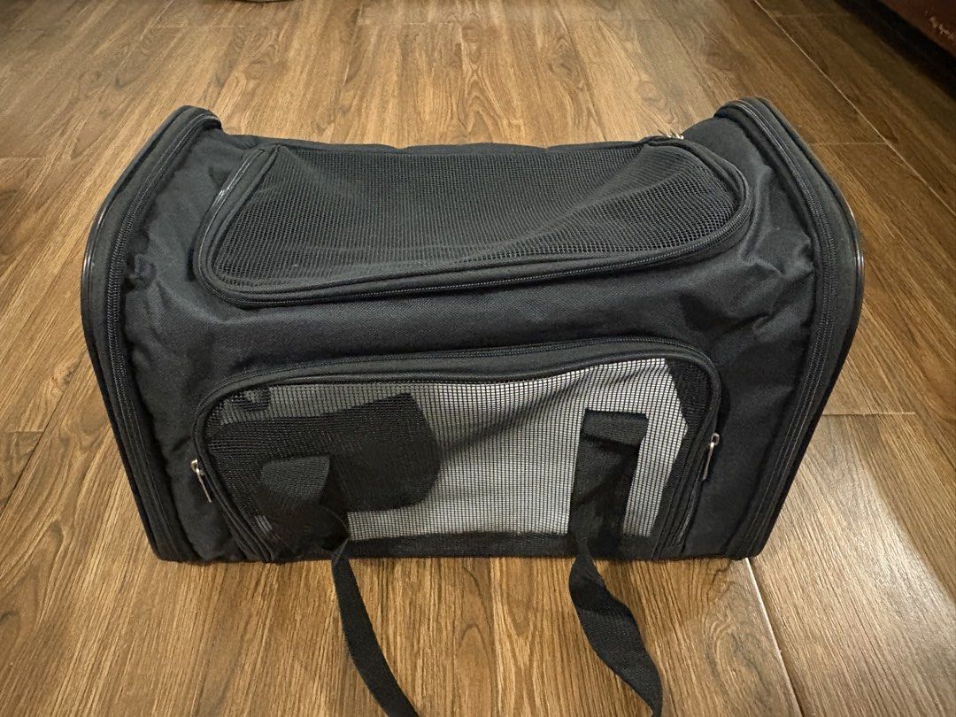 Black Mesh Soft Sided Pet Carrier Bag (Category: Homes & Other Pet Accessories) located in Quezon City. Submitted by nadz.b (Listing ID 1466732827, Image 3). Description: NEVER USED, Original price posted - Color: Black - Type: Soft-sided pet carrier ideal for cats and small dogs - Ventilation: Mesh panels on top and front for airflow - Access: Convenient zipper closures on multiple sides - Portability: Includes carrying handles, a shoulder strap