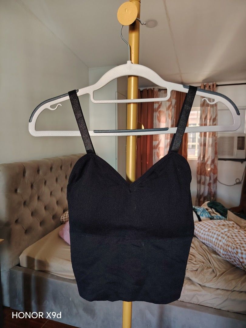 Black Padded Cropped Tank Top with Adjustable Straps (Category: Sleeveless) located in Mabalacat. Submitted by Jackikay.PreLoved (Listing ID 1466597617, Image 1). Description: - Size: XS-SemiMed - Color: Solid black - Fit: Snug, body-hugging ribbed stretch knit - Design: V-neckline front and back with adjustable shoulder straps - Support: Elasticized bottom band - Styling: Perfect basic piece for layering or wearing solo with high-waisted jeans, 