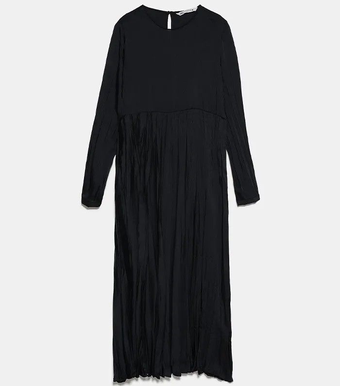 Zara Black Pleated Midi Dress Long Sleeve (Category: Dresses) located in Lupao. Submitted by selahthriftedclothing (Listing ID 1466564151, Image 1). Description: - Color: Solid black - Style: Midi dress with long sleeves and round neckline - Design: Fitted top with a heavily pleated skirt from the waist - Closure: Pullover style with a small back button at the neck - Versatility: Classic, elegant look suitable for work or casual days.