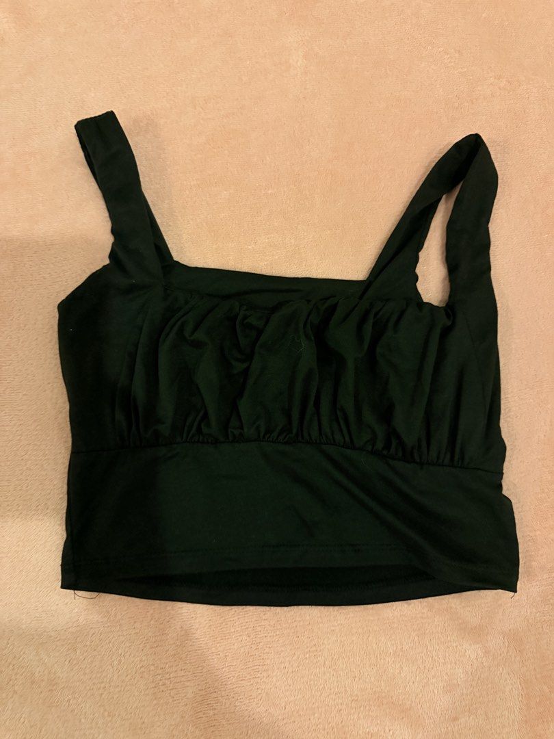 Black Ruched Crop Top Square Neck Tank (Category: Sleeveless) located in Pasig City. Submitted by shop.gelss (Listing ID 1466770053, Image 1). Description: - Color: Black - Style: Crop top with flattering front ruching and square neckline - Straps: Thick shoulder straps - Material: Stretchy and comfortable fabric - Condition: Worn just a couple of times, still in great shape - Pairing: Ideal for high-waisted jeans or skirts.