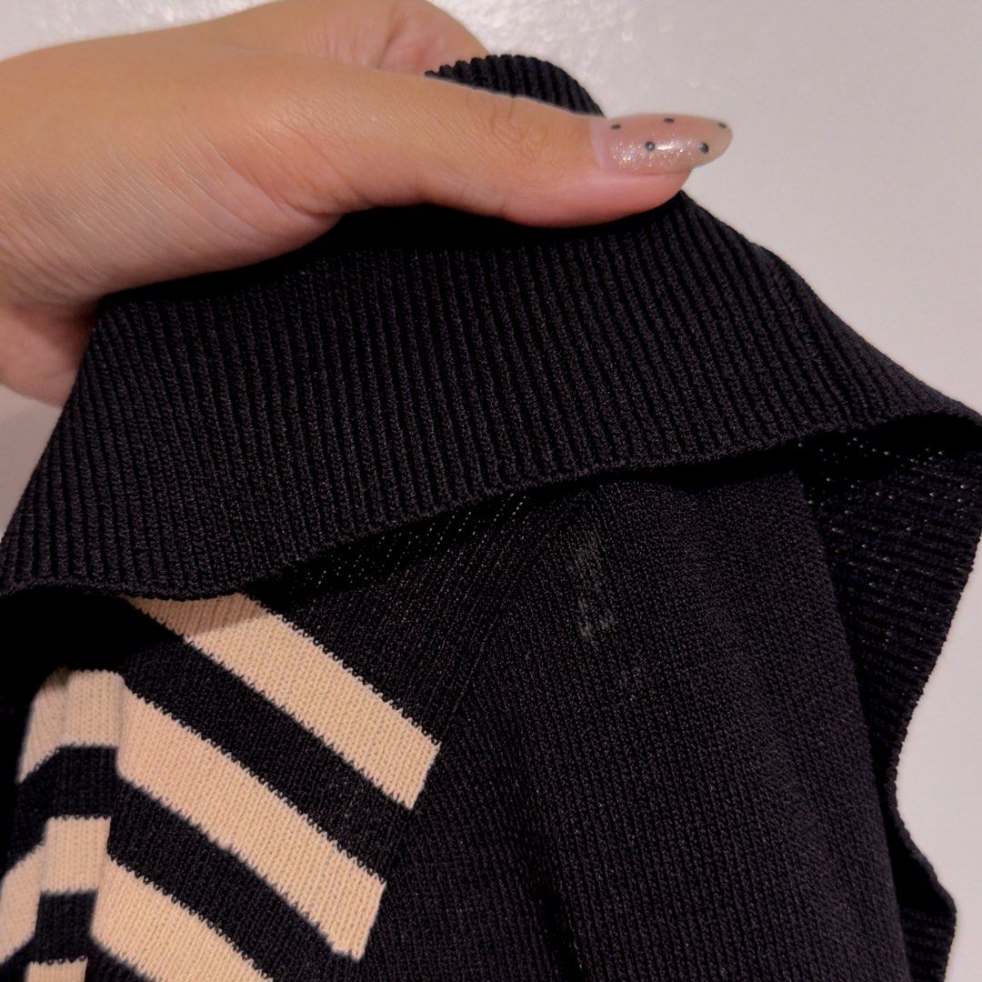 black striped knit off shoulder (Category: Others Tops) located in Cebu City. Submitted by cuteoncue (Listing ID 1466769766, Image 3). Description: small-med please see third photo for minor paint mark on the upper sleeve. it’s barely noticeable when worn but worth noting..