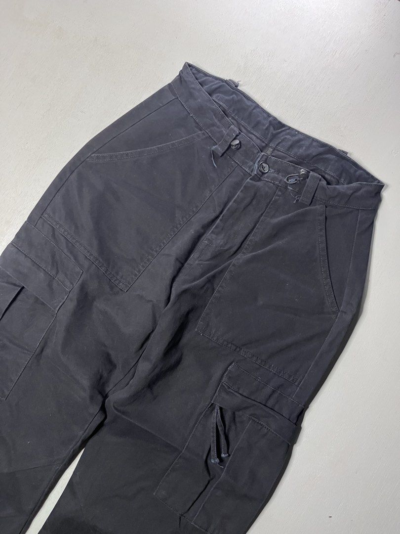 Black Tactical Cargo Pants with Drawstring Cuffs (Category: Joggers) located in Catbalogan. Submitted by yellfindss (Listing ID 1466750862, Image 2). Description: - Color: Solid black -30-32/39.5 l.o 8.5 - Pockets: Multiple deep pockets on front and sides - Details: Drawstring cords on side cargo pocket and adjustable hem toggles - Durability: Sturdy fabric with reinforced knee panels - Closure: Button fly with wide belt loops.