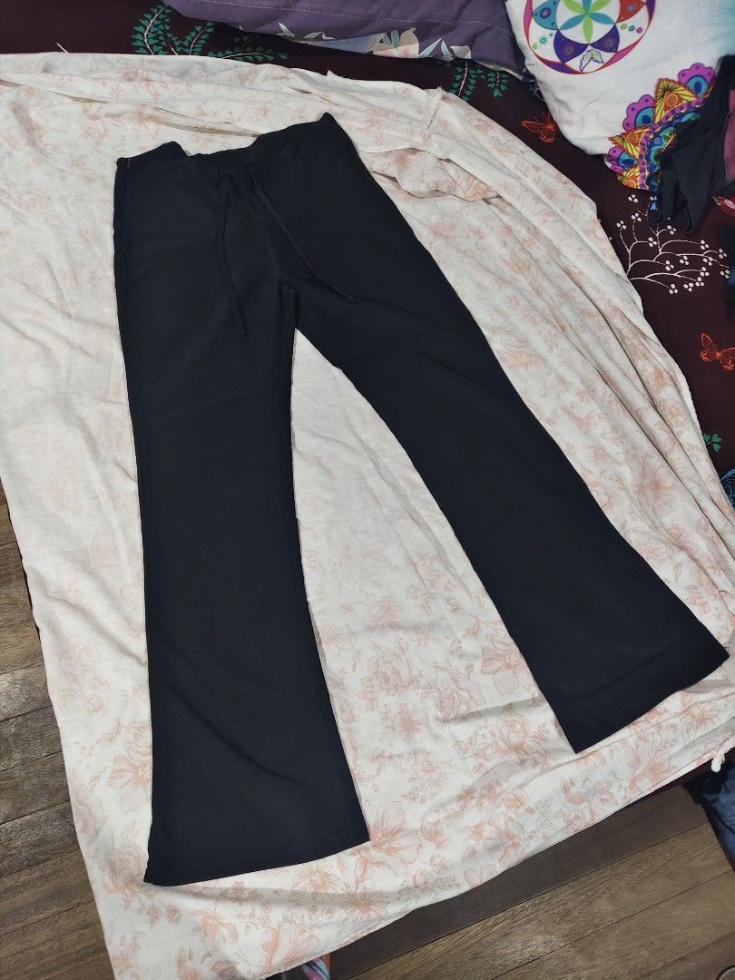 black tie-front wide leg flare pants with drawstrings (Category: Other Bottoms) located in Bulacan. Submitted by angel.decluttersx (Listing ID 1466694639, Image 1). Description: Medium size Waistline 30 inches L 39" W 15" with adjustable drawstrings linen slacks fabric material with one zipper sa side no issue ‼️ good as new ‼️💯.