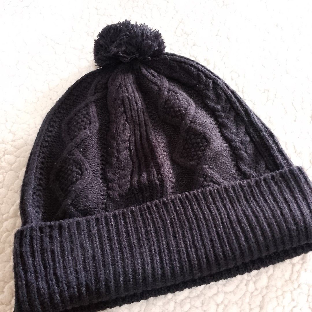 Uniqlo Black Cable Knit Beanie Hat (Category: Hats & Beanies) located in Tuguegarao City. Submitted by thriftedtreasures101.1 (Listing ID 1466771032, Image 2). Description: It features a folded ribbed brim and a traditional mixed cable and diamond textured pattern across the crown. The wide ribbed brim folds up to provide extra warmth around the ears. Slightly used, in good condition. Fabric: Polyester and Wool Size: One Size (Adult / Unisex Fit)