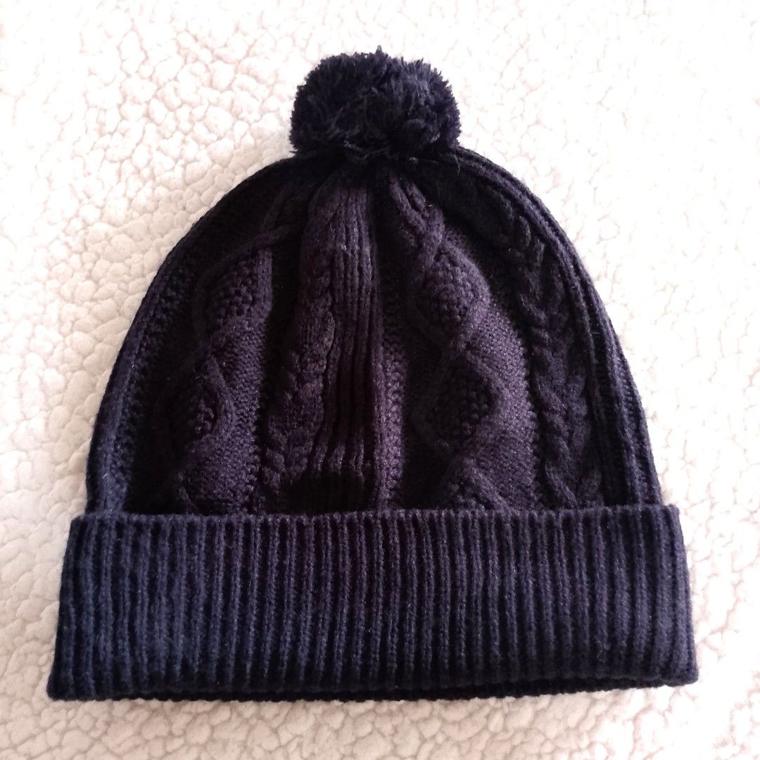 Uniqlo Black Cable Knit Beanie Hat (Category: Hats & Beanies) located in Tuguegarao City. Submitted by thriftedtreasures101.1 (Listing ID 1466771032, Image 1). Description: It features a folded ribbed brim and a traditional mixed cable and diamond textured pattern across the crown. The wide ribbed brim folds up to provide extra warmth around the ears. Slightly used, in good condition. Fabric: Polyester and Wool Size: One Size (Adult / Unisex Fit)