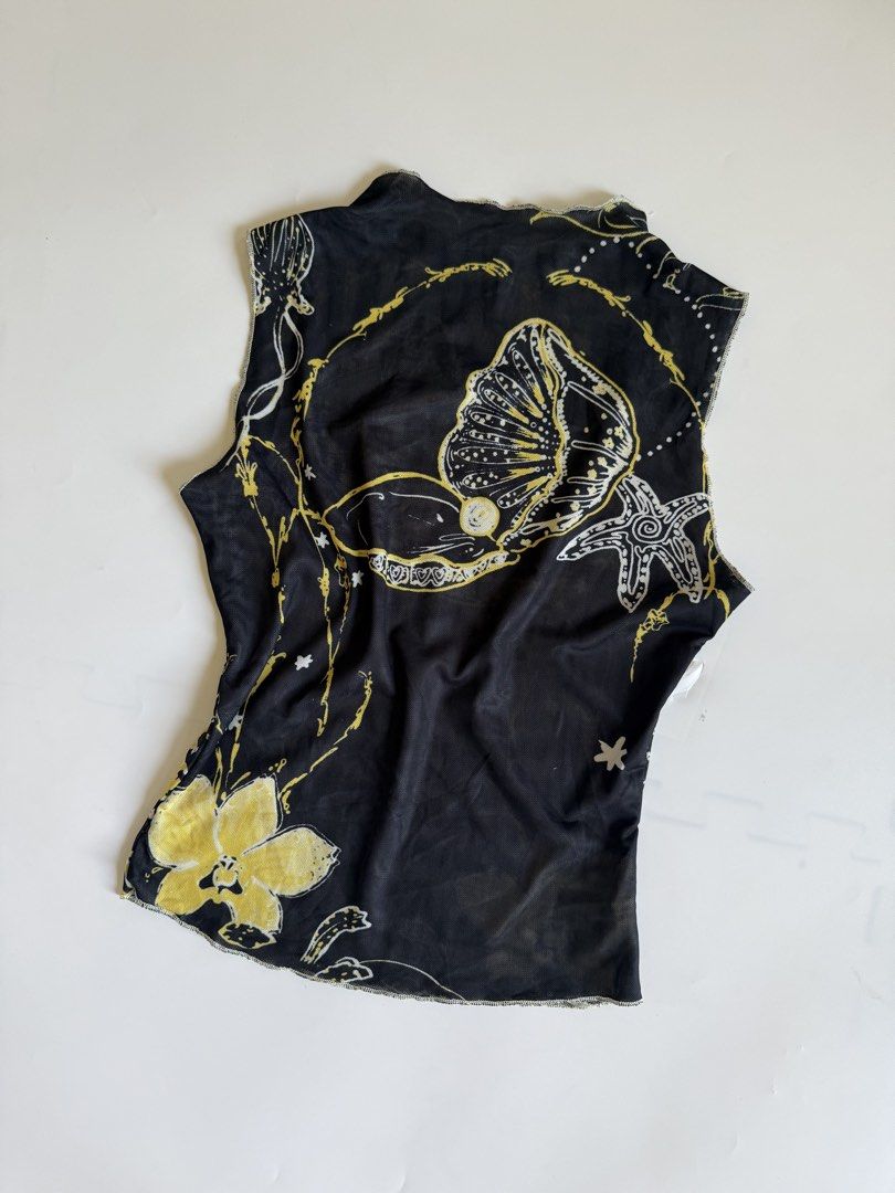 Black Yellow Mesh Shell Star Print Tank Top (Category: Sleeveless) located in Tarlac. Submitted by kr_closet (Listing ID 1466705215, Image 2). Description: - Style: Sheer mesh tank top with ocean-inspired print - Details: Features seashells, starfish, and a large flower at the hem - Material: Lightweight, stretchy, and unlined fabric - Design: Lettuce trim edges on the neckline and armholes - Versatility: Great for layering over bralettes or basi