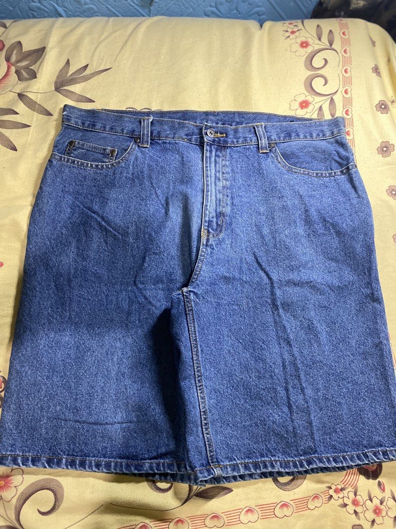 Blue Denim Shorts (Category: Shorts) located in Bacolor. Submitted by paw_thrift (Listing ID 1466690471, Image 2). Description: - Color: Medium blue - Design: Classic five-pocket style with contrast stitching - Fit: Roomy and comfortable for everyday casual wear - Features: Sturdy belt loops and secure metal button closure - Condition: Clean and solid construction.