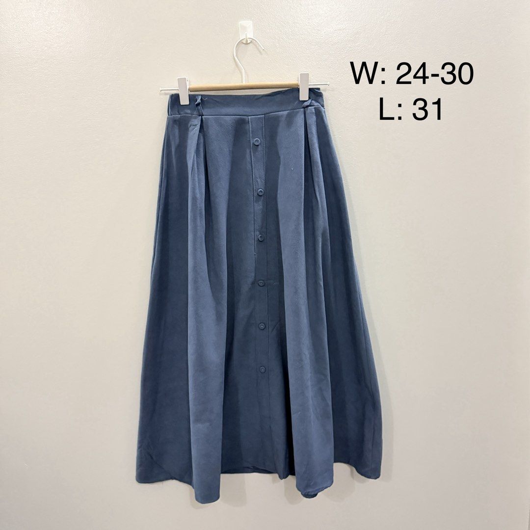 Blue Midi Skirt with Front Buttons (Category: Skirts) located in Rodriguez. Submitted by jrms23 (Listing ID 1466769941, Image 1). Description: - Color: Blue - Style: Midi skirt with front buttons and pleated waistband - Fabric: Soft and flowy material - Size: Fits waist 24 to 30 inches - Length: 31 inches - Versatile piece, perfect for matching with simple tees or blouses.