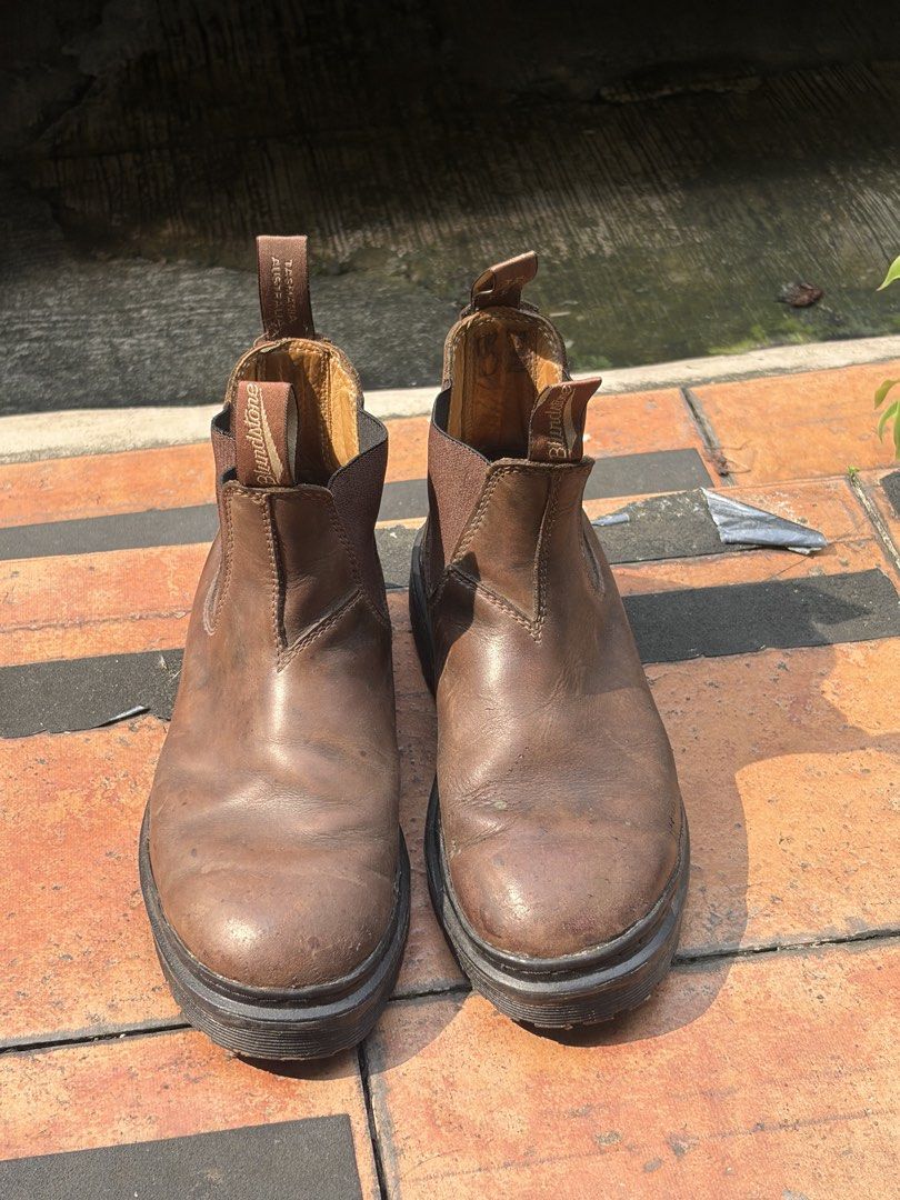 Blundstone Brown Chelsea Boots (Category: Boots) located in Quezon City. Submitted by nikoabl (Listing ID 1466567436, Image 2). Description: Blundstone Chelsea boots in brown leather. Elastic side gussets, pull tabs at front and back. Chunky lug soles with good grip. Dr. Scholl's insoles inside for extra comfort. Shows natural creasing, scuffs, and wear on the leather from regular use. Solid boots, ready for more wear. Worn good Changed outsoles 
