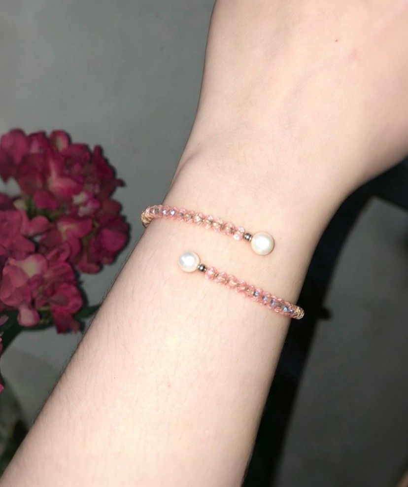 Blush Peach Crystal & Pearl Wrap Bracelet (Category: Bracelets) located in Manila. Submitted by hollysansh (Listing ID 1466716355, Image 2). Description: • Beads: Faceted peach / champagne crystal • Accents: 2 genuine freshwater pearls • Style: Flexible double-wrap bangle — fits most wrist sizes • Color: Warm blush peach with iridescent shine.