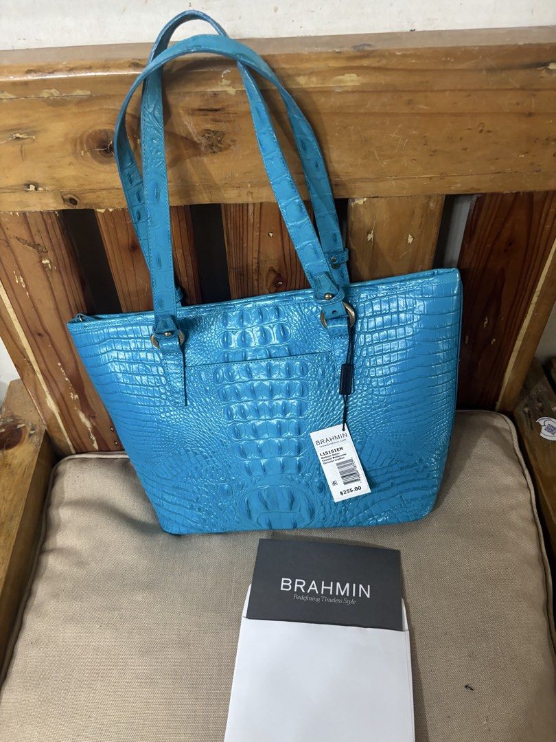 Brahmin Medium Asher Enamel Melbourne Leather Tote Bag (Category: Tote Bags) located in Famy. Submitted by frenchmacaroon (Listing ID 1466581294, Image 3). Description: - Brand: Brahmin - Model: Medium Asher Tote - Color: Bright Blue (Enamel Melbourne) - Material: Croc-embossed leather - Hardware: Gold-tone - Features: Dual shoulder straps, matching tassel charms, top zip closure, rear exterior slip pocket - Condition: Brand new with dust bag and