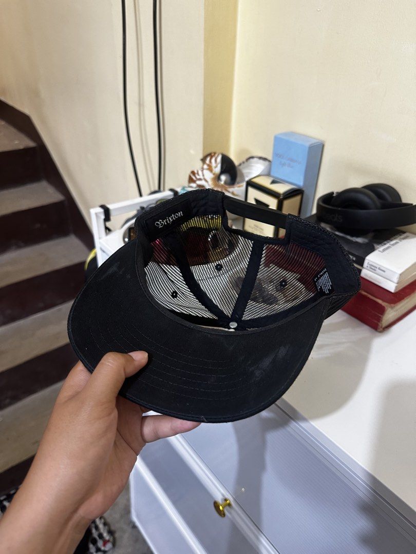 Brixton Trucker Hat (Category: Caps & Hats) located in Baler. Submitted by sidequester (Listing ID 1466582468, Image 3). Description: - Brand: Brixton - Color: Black and Off-White - Design: Structured front panel with centered stitched logo patch - Ventilation: Classic mesh back panels for breathability - Brim: Flat brim style - Fit: Adjustable snapback closure for a custom fit - MOP: Any online bank or e-wallets - MOD: Can do meet up and ship na