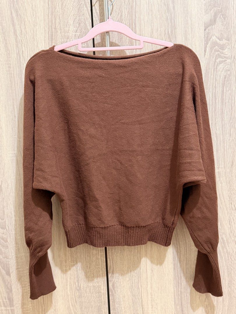 Brown Batwing Sleeve Knit Sweater (Category: Coats, Jackets and Outerwear) located in Manila. Submitted by anj_1414 (Listing ID 1466768273, Image 1). Description: - Color: Brown - Style: Relaxed fit with wide batwing sleeves and wide neckline - Details: Ribbed cuffs and bottom hem - Material: Soft and warm knit - Pairing: Great with high-waisted jeans or skirts - Condition: Excellent.