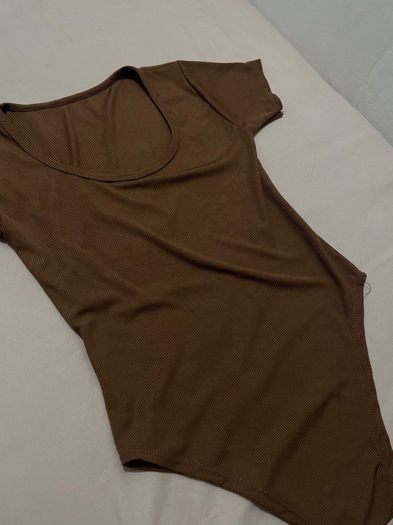 Brown Bodysuit Scoop Neck Top (Category: Sleeveless) located in Manila. Submitted by eyyarrios82239 (Listing ID 1466591804, Image 2). Description: Preloved Dress Selling Price — P50.00 Size — Small to Medium Courier — Lalamove or Self Pick Up Only Location — Balingasa, Quezon City (Near Ayala Malls Cloverleaf/ A.Bonifacio) Mode of Payment — Gcash upon pick up.