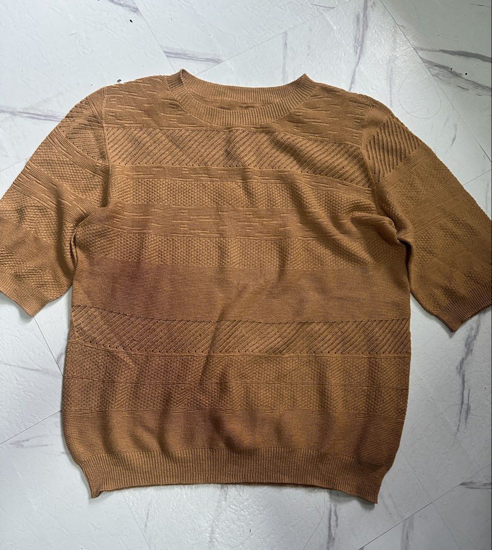 Brown Knit Half Sleeve Crewneck (Category: Coats, Jackets and Outerwear) located in Manila. Submitted by tipidfinds888 (Listing ID 1466616496, Image 1). Description: - Color: Brown - Design: Crewneck with short half sleeves - Texture: Varied ribbed patterns on front and sleeves - Material: Comfortable stretch fabric - Fit: Standard pullover style, great for easy layering.
