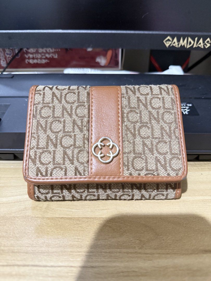 Brown Monogram Pattern Tri-Fold Wallet (Category: Luxury Bags & Wallets) located in Paranaque City. Submitted by ginggersnapx (Listing ID 1466675978, Image 1). Description: Well used CLN wallet -meet up (Naga Camarines Sur) -delivery J&T or LBC.