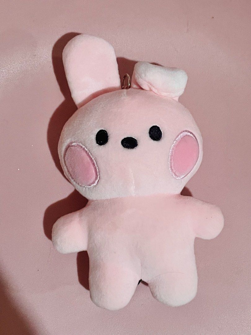 BT21 Cooky Plush Charm (Category: Plushies & Soft Toys) located in Pasig City. Submitted by babystarcandykoo (Listing ID 1466764831, Image 1). Description: - Adorable pink bunny plush keychain - Made from ultra-soft, fluffy fabric - Features cute black embroidered facial details and big pink cheeks - Unique design with one upright ear and one floppy ear - Equipped with a sturdy metal ring for keys or bags - Excellent, clean condition with no stai