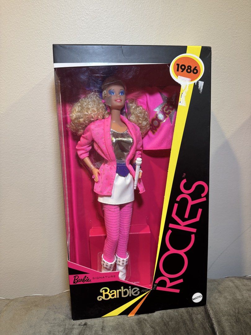 Bundle Brand new Barbies for only 6k (Category: Kids Toys) located in Manila. Submitted by coolwolf_7ee5a0 (Listing ID 1466657873, Image 1). Description: - Brand: Mattel - Series: The Rockers (1986 Vintage Collector Item) - Appearance: Blonde curly hair, vibrant blue eye makeup - Outfit: Pink jacket, silver top, white skirt, and striped leggings - Accessories: Includes original white microphone - Packaging Detail: Features bold 1986 sticker on up