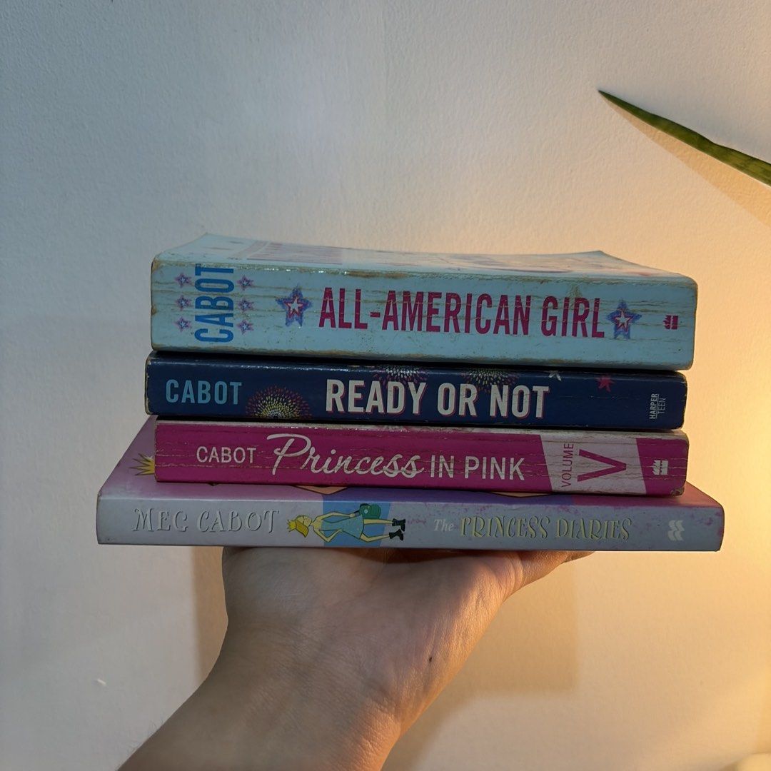Bundle: Meg Cabot Mass Market Paperback (Category: Storybooks) located in Manila. Submitted by ajdeclutter (Listing ID 1466587595, Image 1). Description: - Author: Meg Cabot - Set of 4 young adult paperbacks - Titles: All-American Girl, Ready or Not, Princess in Pink (Vol. 5), and The Princess Diaries - Condition: Minor shelf wear on covers and yellowing along page edges - Genre: Teen fiction and romance .
