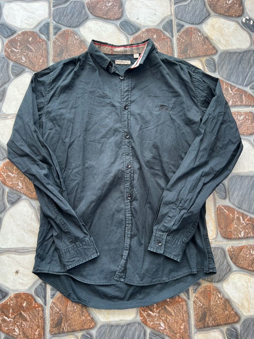 Burberry Brit Black Button Down Shirt Size L (Category: Shirts) located in Caloocan City. Submitted by sillapwet0606 (Listing ID 1466566632, Image 1). Description: - Brand: Burberry Brit - Color: Black - Size: L (tag on collar) - Logo: Classic embroidered equestrian knight on chest - Detail: Iconic check pattern lining inside the collar - Closure: Branded buttons down the front - Care: Machine washable - Material Note: Contains non-textile parts 