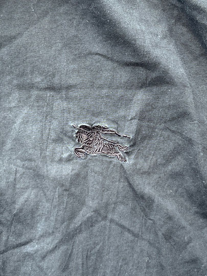 Burberry Brit Black Button Down Shirt Size L (Category: Shirts) located in Caloocan City. Submitted by sillapwet0606 (Listing ID 1466566632, Image 2). Description: - Brand: Burberry Brit - Color: Black - Size: L (tag on collar) - Logo: Classic embroidered equestrian knight on chest - Detail: Iconic check pattern lining inside the collar - Closure: Branded buttons down the front - Care: Machine washable - Material Note: Contains non-textile parts 