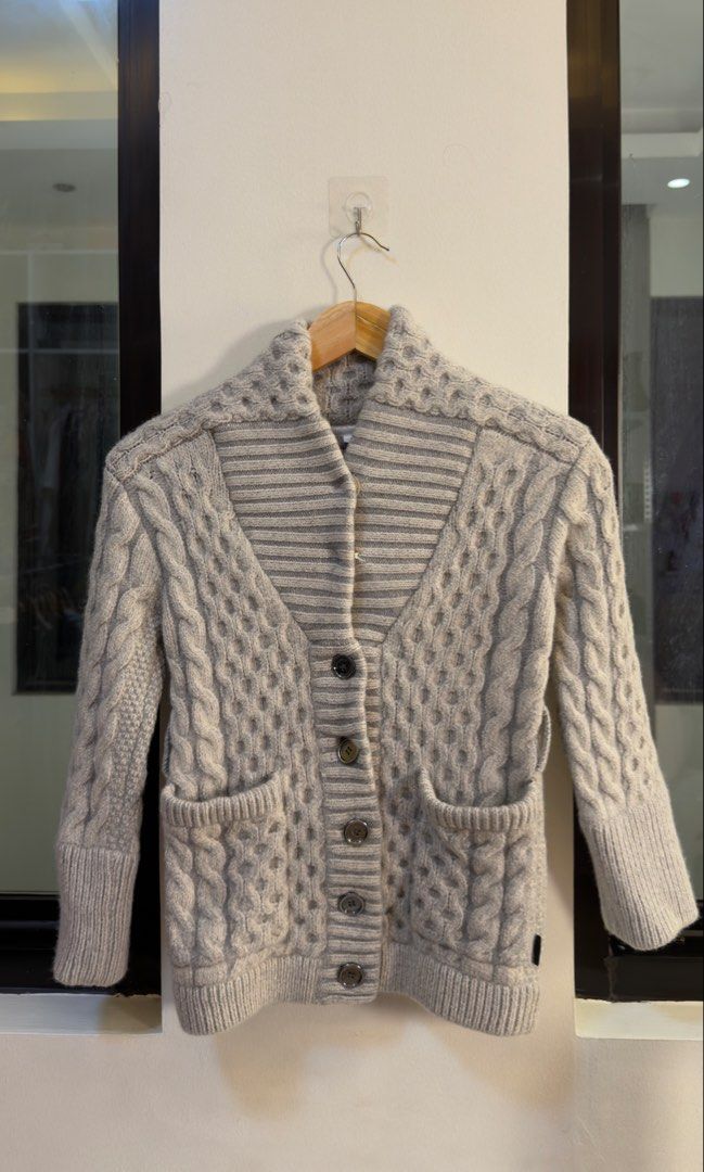 Burberry Cable Knit Wool Blend Cardigan Grey (Category: Coats, Jackets and Outerwear) located in Paranaque City. Submitted by preluxeshop_ph (Listing ID 1466765198, Image 2). Description: Burberry Cable Knit Wool Blend Cardigan Grey -Classic cable knit design -Button front closure -Condition: 9.8/10 -Dimes: Length: 20” Width: 15”.