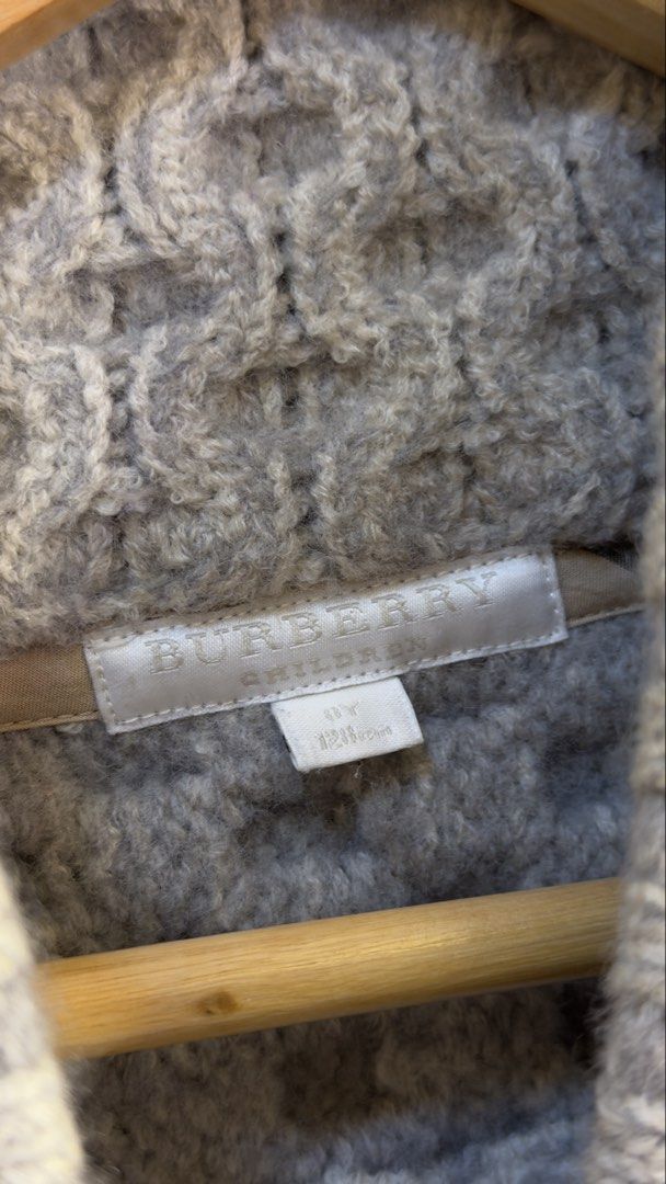 Burberry Cable Knit Wool Blend Cardigan Grey (Category: Coats, Jackets and Outerwear) located in Paranaque City. Submitted by preluxeshop_ph (Listing ID 1466765198, Image 3). Description: Burberry Cable Knit Wool Blend Cardigan Grey -Classic cable knit design -Button front closure -Condition: 9.8/10 -Dimes: Length: 20” Width: 15”.