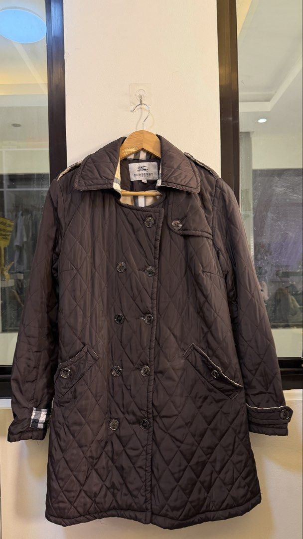 Burberry London Quilted Jacket (Category: Coats, Jackets and Outerwear) located in Paranaque City. Submitted by preluxeshop_ph (Listing ID 1466761085, Image 2). Description: Burberry London Quilted Jacket Size L - Features iconic check lining - Double-breasted closure with button details - Made in London - Ideal for layering.