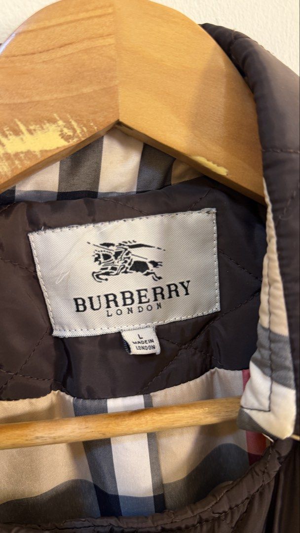 Burberry London Quilted Jacket (Category: Coats, Jackets and Outerwear) located in Paranaque City. Submitted by preluxeshop_ph (Listing ID 1466761085, Image 3). Description: Burberry London Quilted Jacket Size L - Features iconic check lining - Double-breasted closure with button details - Made in London - Ideal for layering.