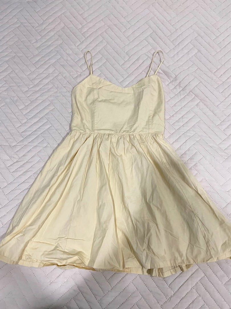 Butter yellow Dress (Category: Dresses) located in Manila. Submitted by pandaaa_loo (Listing ID 1466725637, Image 1). Description: - Color: butter yellow - Style: Sleeveless skater dress with spaghetti straps and sweetheart neckline - Fit: Fitted bodice, flared pleated skirt, and smocked back panel for stretch - Fabric: Light and breezy, perfect for warm weather - Condition: Needs a quick steam iron due to storage folds.