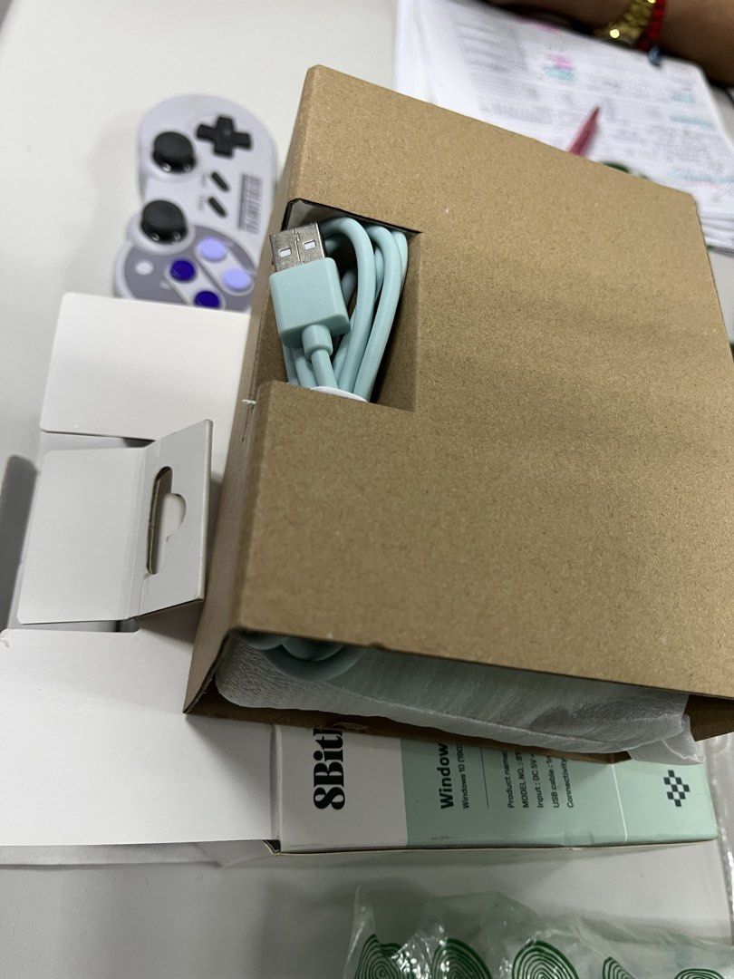 Buy 1 take 1 8BitDo Pro 2 Bluetooth Gamepad Mint Green (Category: Controllers) located in Manila. Submitted by ncmbrbgddf58183 (Listing ID 1466615889, Image 3). Description: - Authentic 8BitDo wireless Bluetooth gamepad in mint green - Eye-catching orange d-pad and action buttons - Includes matching light blue USB charging cable and original box packaging - Bonus: Extra grey SNFC-style controller included in the bundle - Compatible with multiple 