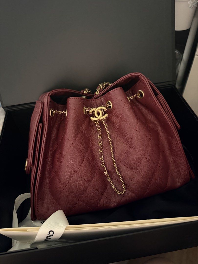 C25 Burgundy Caviar Leather Bag (Category: Purses & Pouches) located in Pasig City. Submitted by glamomma (Listing ID 1466580670, Image 2). Description: RUSH SALE!!! Burgundy caviar leather chain bag, gold hardware. Drawstring closure with interlocking CC logo charm. Diamond quilting pattern throughout. Side flap pockets with CC turn-locks. Chain strap interwoven with matching leather..