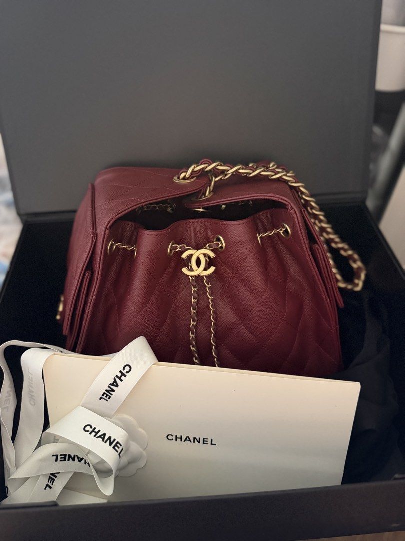 C25 Burgundy Caviar Leather Bag (Category: Purses & Pouches) located in Pasig City. Submitted by glamomma (Listing ID 1466580670, Image 1). Description: RUSH SALE!!! Burgundy caviar leather chain bag, gold hardware. Drawstring closure with interlocking CC logo charm. Diamond quilting pattern throughout. Side flap pockets with CC turn-locks. Chain strap interwoven with matching leather..