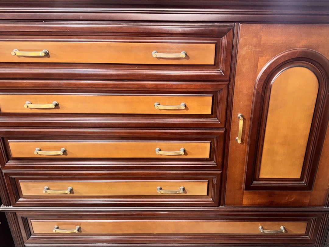 Cabinet (Category: Shelves, Cabinets & Racks) located in Imus. Submitted by juantosell777 (Listing ID 1466639522, Image 3). Description: - Large solid wooden dresser in a rich dark brown finish - Contrast light brown drawer fronts with multiple sizes for ample storage - Upright side cabinet featuring an elegant arched glass door panel - Fitted with matching antique-style metal handles throughout - Perfect for organizing clothes and bedroom access