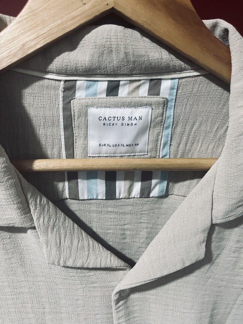 Cactus Man Polo Short Sleeve (Category: Formal Shirts) located in Quezon City. Submitted by wacpon_061972 (Listing ID 1466699987, Image 1). Description: Beige textured short-sleeve resort-collar shirt with a striped inner neck tape..
