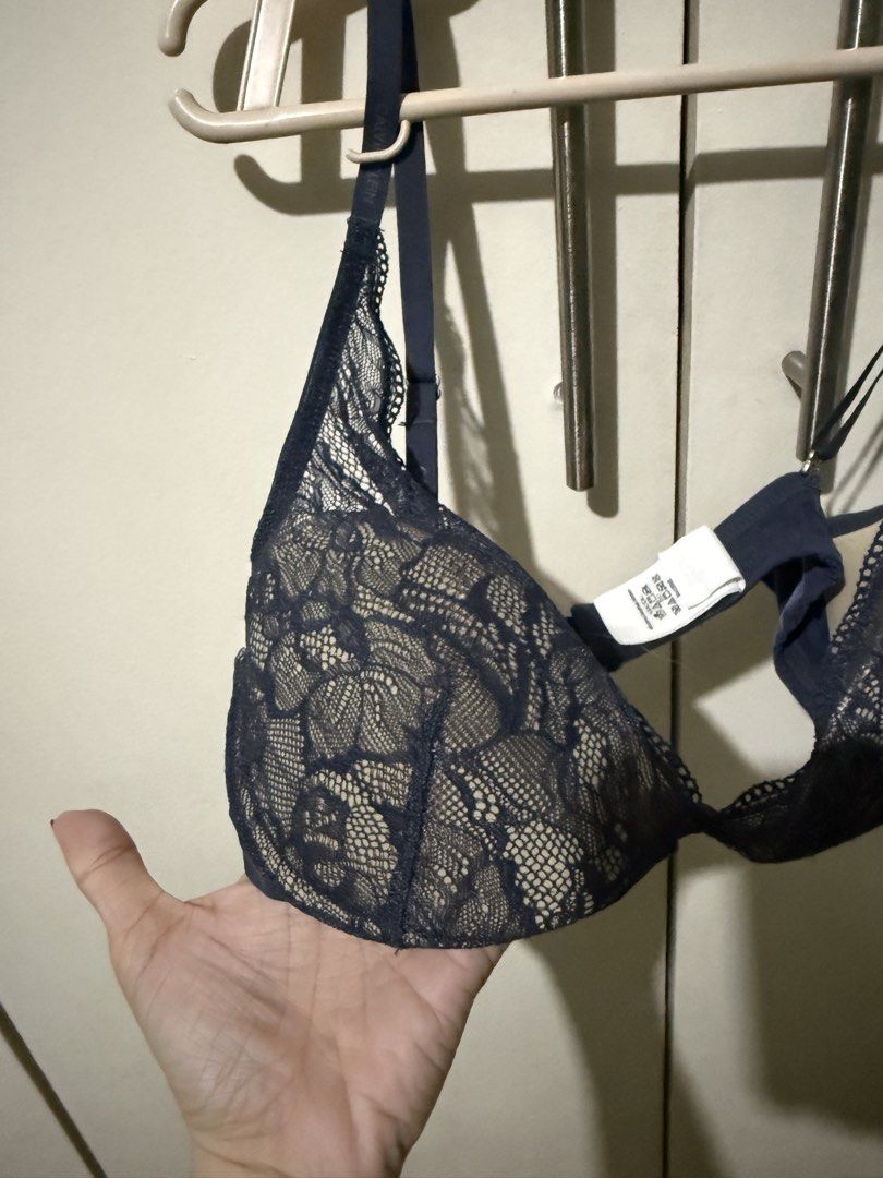 Calvin Klein Dark Blue Lace Bra (Category: Undergarments & Loungewear) located in Marikina City. Submitted by moonchok (Listing ID 1466719537, Image 2). Description: Brand: Calvin Klein Color: Dark navy blue Intricate floral lace over molded cups Straps: Adjustable with printed Calvin Kleinbrand logo Hardware: Branded metal detail between cups - Material: Soft, stretchy, and comfortable for daily wear - Condition: like new / Excellent - Mode of P