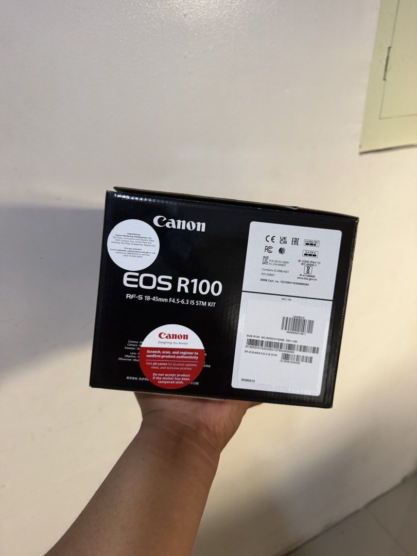 Canon EOS R100 RF-S 18-45mm IS STM Kit (Category: Cameras) located in Manila. Submitted by lipatbahaysale (Listing ID 1466618361, Image 2). Description: With receipt po kanina lang nabili oct 8 2026 benta kasi hindi ko po gusto. - Brand: Canon EOS R100 Mirrorless Camera Kit - Lens: RF-S 18-45mm F4.5-6.3 IS STM lens included - Condition: Brand new, never opened, original seal sticker intact - Packaging: Original retail box with clearly printed ser