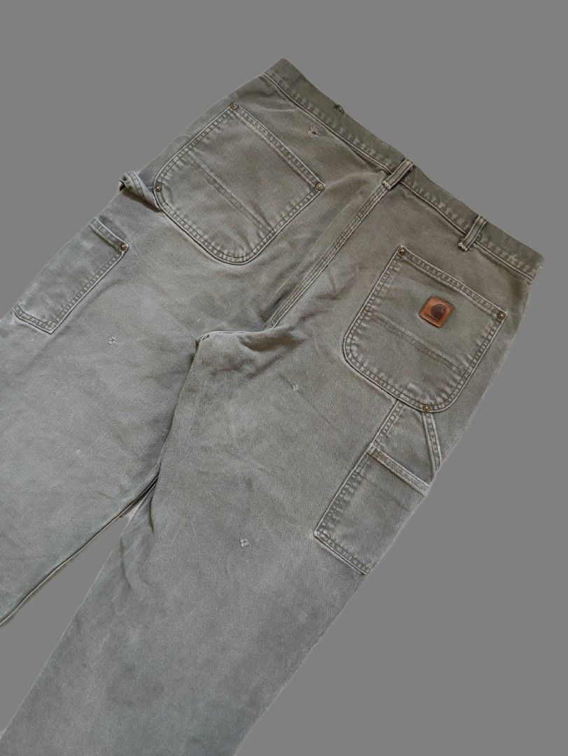Carhartt B136 MOS Double Knee Carpenter Pants (Category: Jeans) located in Calamba. Submitted by alorbis96758 (Listing ID 1466567646, Image 2). Description: ▪️Dimensions Length : 44 Waist : 34~35 Hem : 9 ▪️Original Dungaree Fit ▪️Zippers Working Condition : Excellent ▪️Complete Tags ✅ ▪️Overall Condition : Used - Workwear ▪️Issues : Distress, Minimal Stain, Fadings, Ripped.
