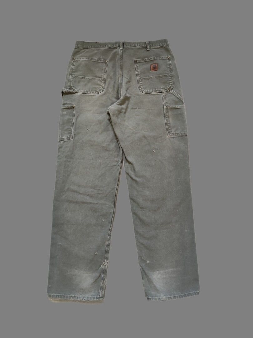 Carhartt B136 MOS Double Knee Carpenter Pants (Category: Jeans) located in Calamba. Submitted by alorbis96758 (Listing ID 1466567646, Image 1). Description: ▪️Dimensions Length : 44 Waist : 34~35 Hem : 9 ▪️Original Dungaree Fit ▪️Zippers Working Condition : Excellent ▪️Complete Tags ✅ ▪️Overall Condition : Used - Workwear ▪️Issues : Distress, Minimal Stain, Fadings, Ripped.