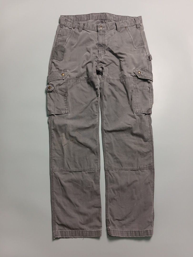 Carhartt Relaxed Fit Ripstop Cargo Work Pants (Category: Trousers) located in Manila. Submitted by hustler_777 (Listing ID 1466669784, Image 1). Description: Back Design Elements Reinforced Pockets: The top trim of both rear pockets is heavily reinforced with a durable fabric overlay to prevent fraying from clip-on tools (like tape measures or knives). Classic Branding: The iconic square orange-and-white Carhartt logo patch is sewn directly onto 