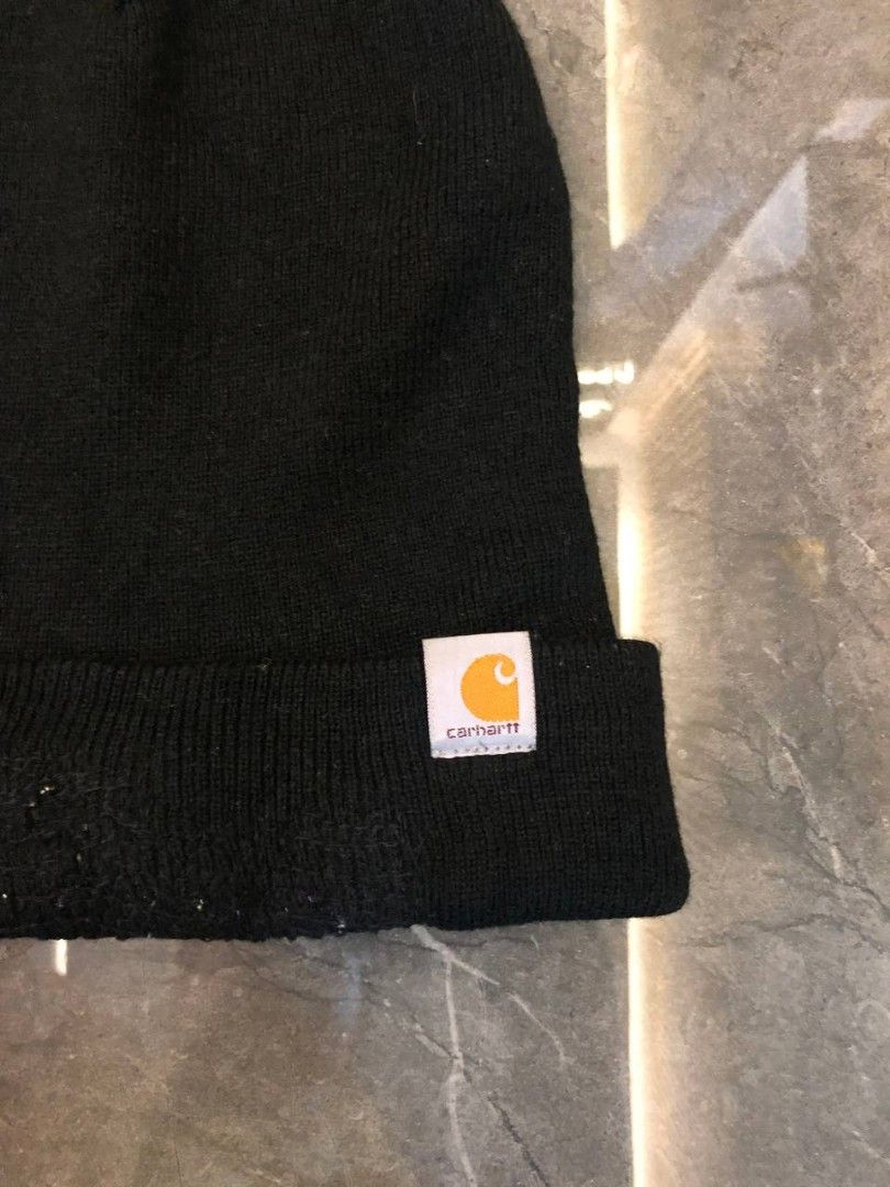Carhat Black Beanie Knit Hat (Category: Hats & Beanies) located in Santa Cruz. Submitted by remsonnnc (Listing ID 1466625568, Image 2). Description: - Color: Classic black - Style: Knit beanie with folded brim and Carhartt square logo patch - Condition: Pre-loved with minor fabric wear, piling near the front, and slight seam pulling at the top crown - Vibe: Essential winter streetwear for cold weather Issue on pic and cut tag 380 + sf Location: L