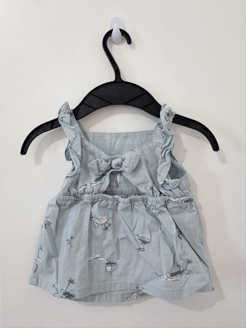Carter's 18M+ light blue top (Category: Babies & Kids Fashion) located in Manila. Submitted by justjahz0928 (Listing ID 1466573894, Image 2). Description: - Color: Light blue - Design: All-over nautical print with sailboats, whales, and palm trees - Details: Ruffled shoulder straps and a sweet bow detail at the upper back - Fit: Gathered waist for a flowy and comfortable feel - Styling: Great for warm weather, easy to pair with shorts or trousers