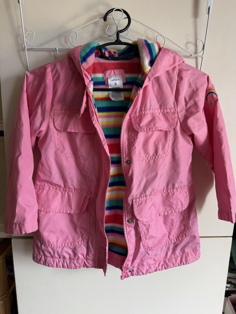 Carter's Pink Rainbow Stripe Fleece Lined Jacket Size 5 (Category: Babies & Kids Fashion) located in Quezon City. Submitted by bubspreloved (Listing ID 1466770901, Image 1). Description: - Brand: Carter's - Size: 5 - Color/Design: Pink with vibrant rainbow striped we fleece lining and hood - Features: Front pockets, zipper closure with snap buttons, and rainbow patch on left sleeve - Perfect for keeping your child warm and stylish!.