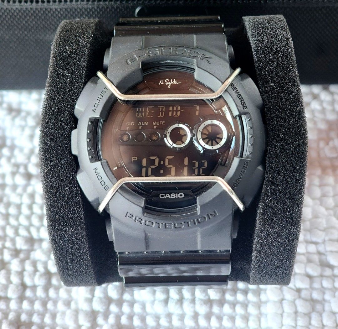Gshock (Category: Men's Watches) located in Imus. Submitted by alecsssss (Listing ID 1466569589, Image 1). Description: - Strap: Black resin strap with stainless steel buckle - Condition: Noticeable paint peeling and wear on the strap keepers from previous use, fully functional - Special Features: Nigel Sylvester signature engraved on the back case - Bought in Japan - NO BOX - Personal collection. Decluttering.